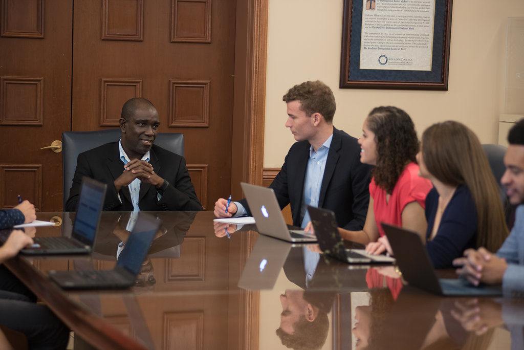 Dr. Keith Whittingham With Students in Boardroom