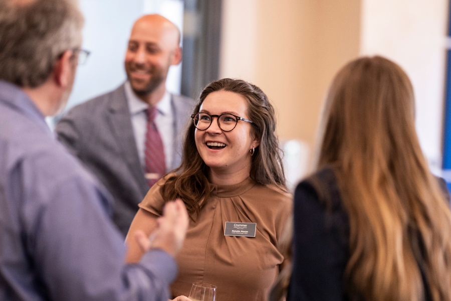 Crummer student networking at an event.