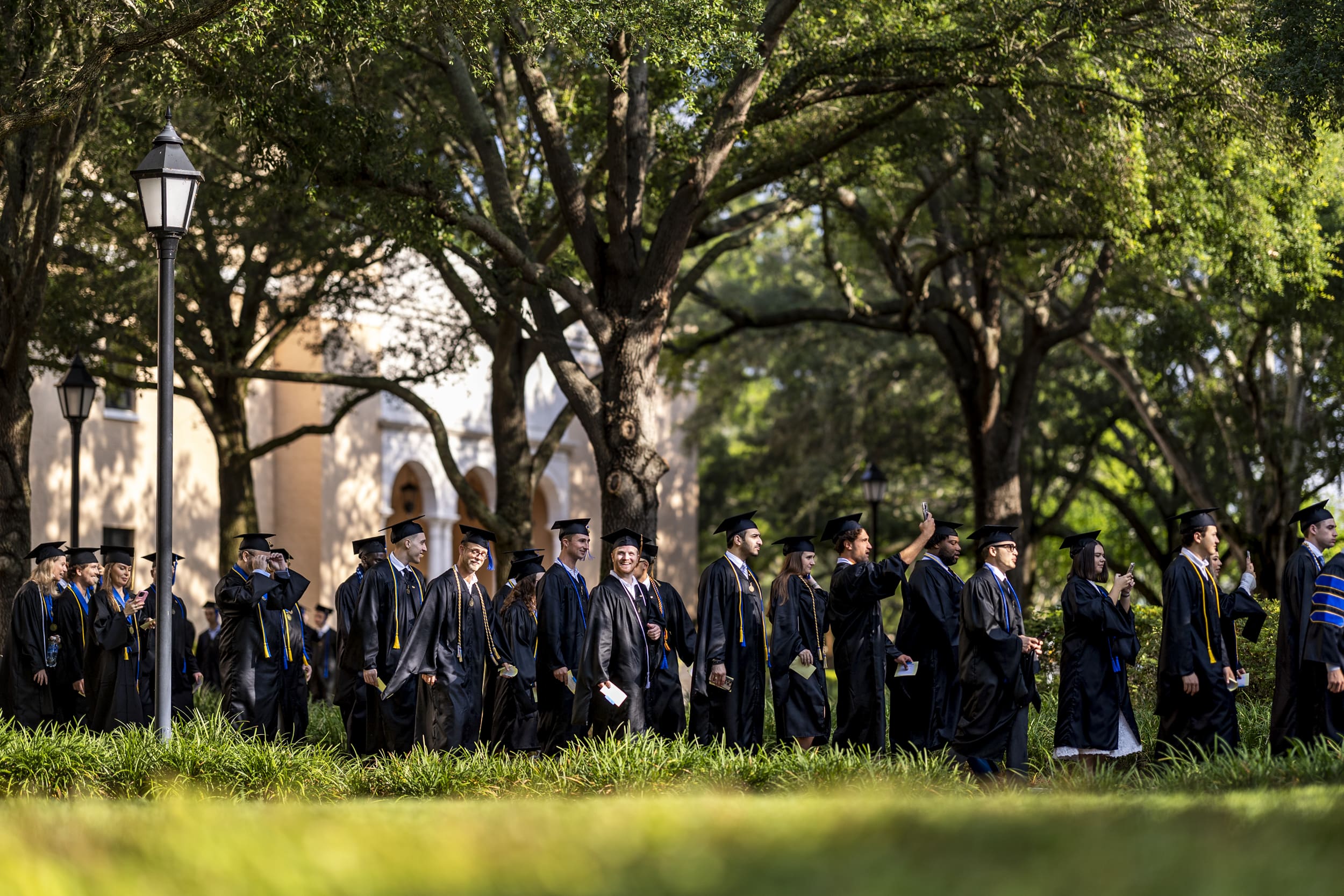 Graduates procession during the Crummer Commencement ceremony.