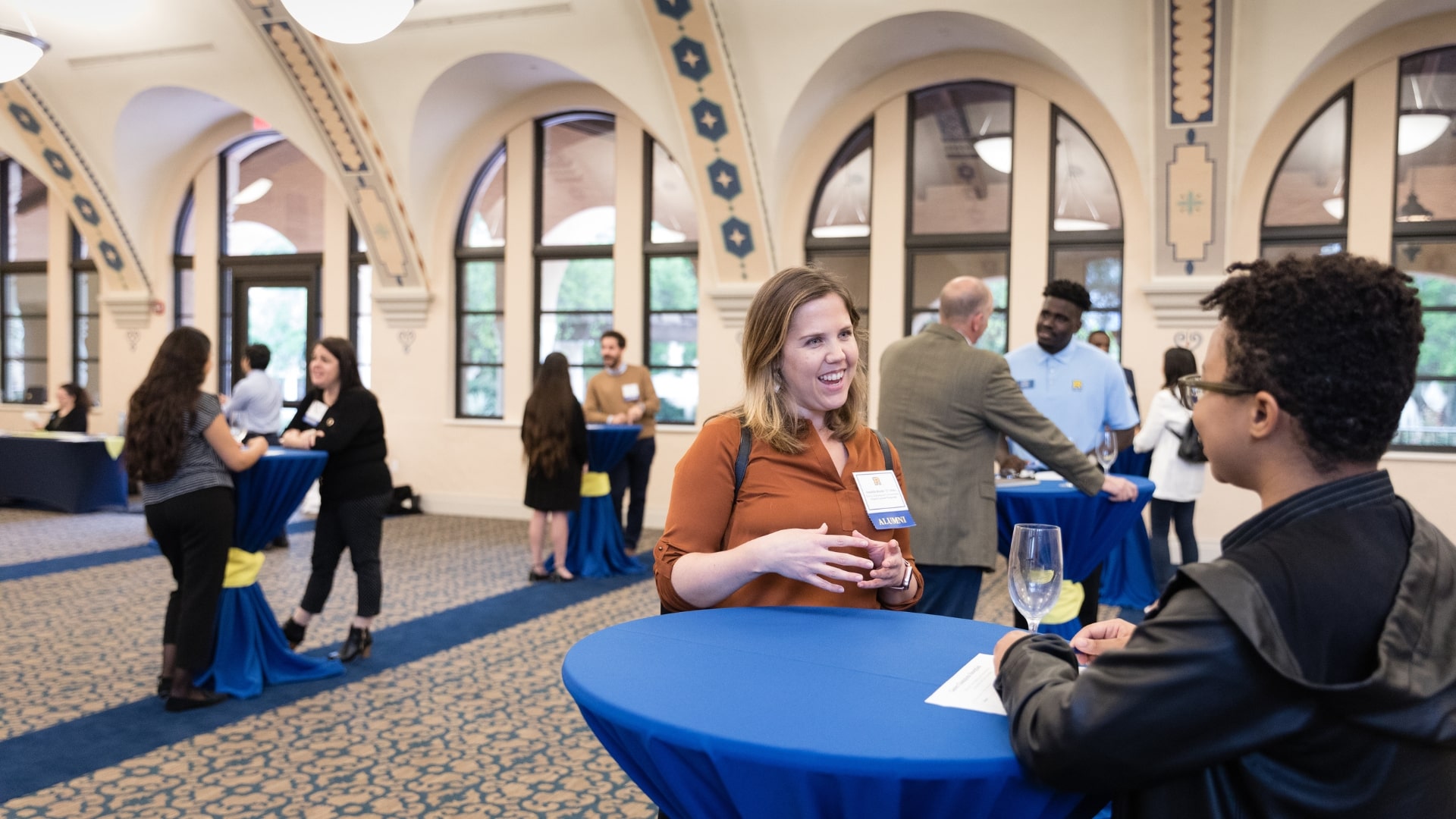 Alumni helping students at career networking event.