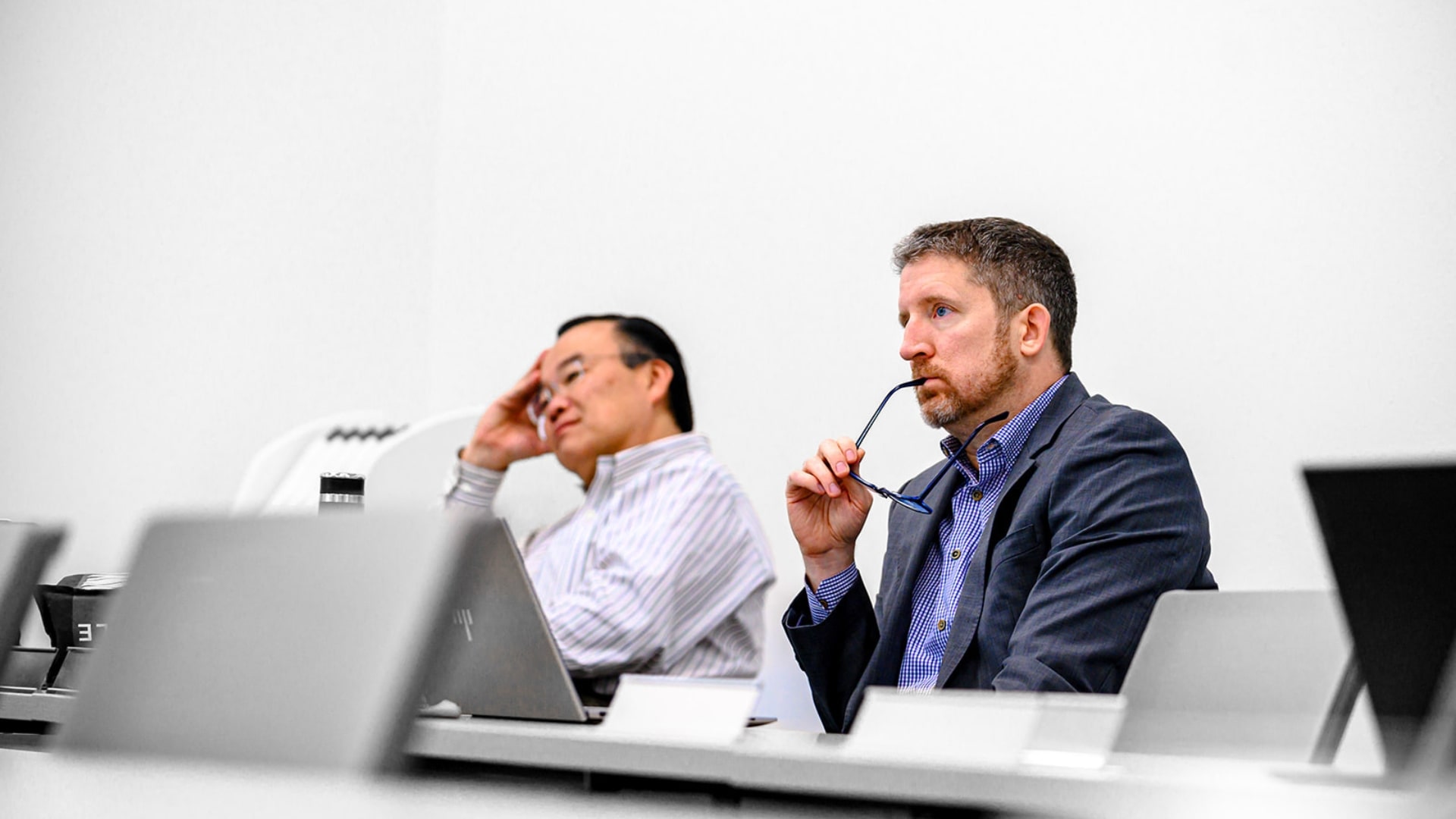 two men focusing on lecture