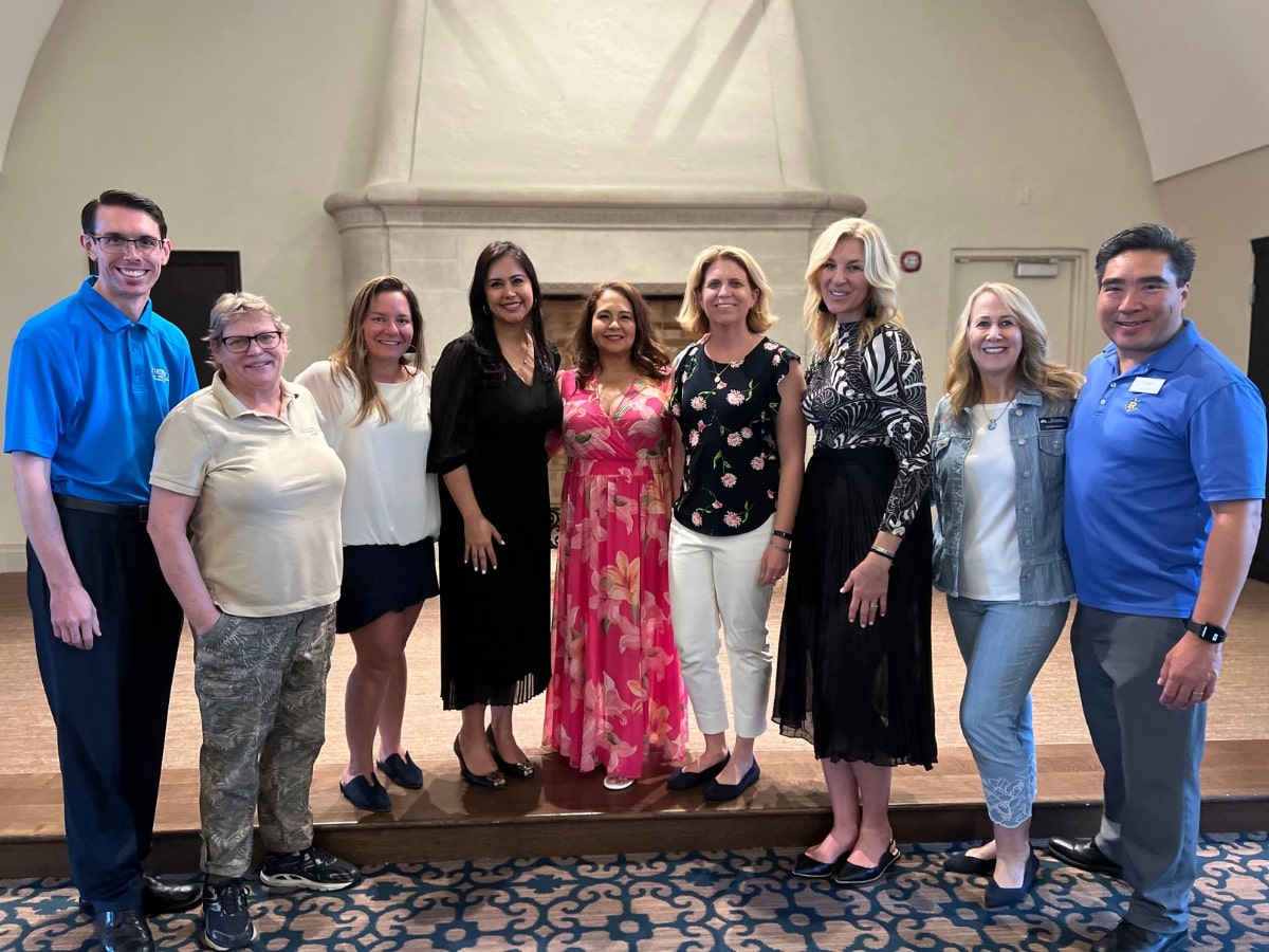 Current and former Crummer alumni board members at an alumni event on the Rollins College campus.