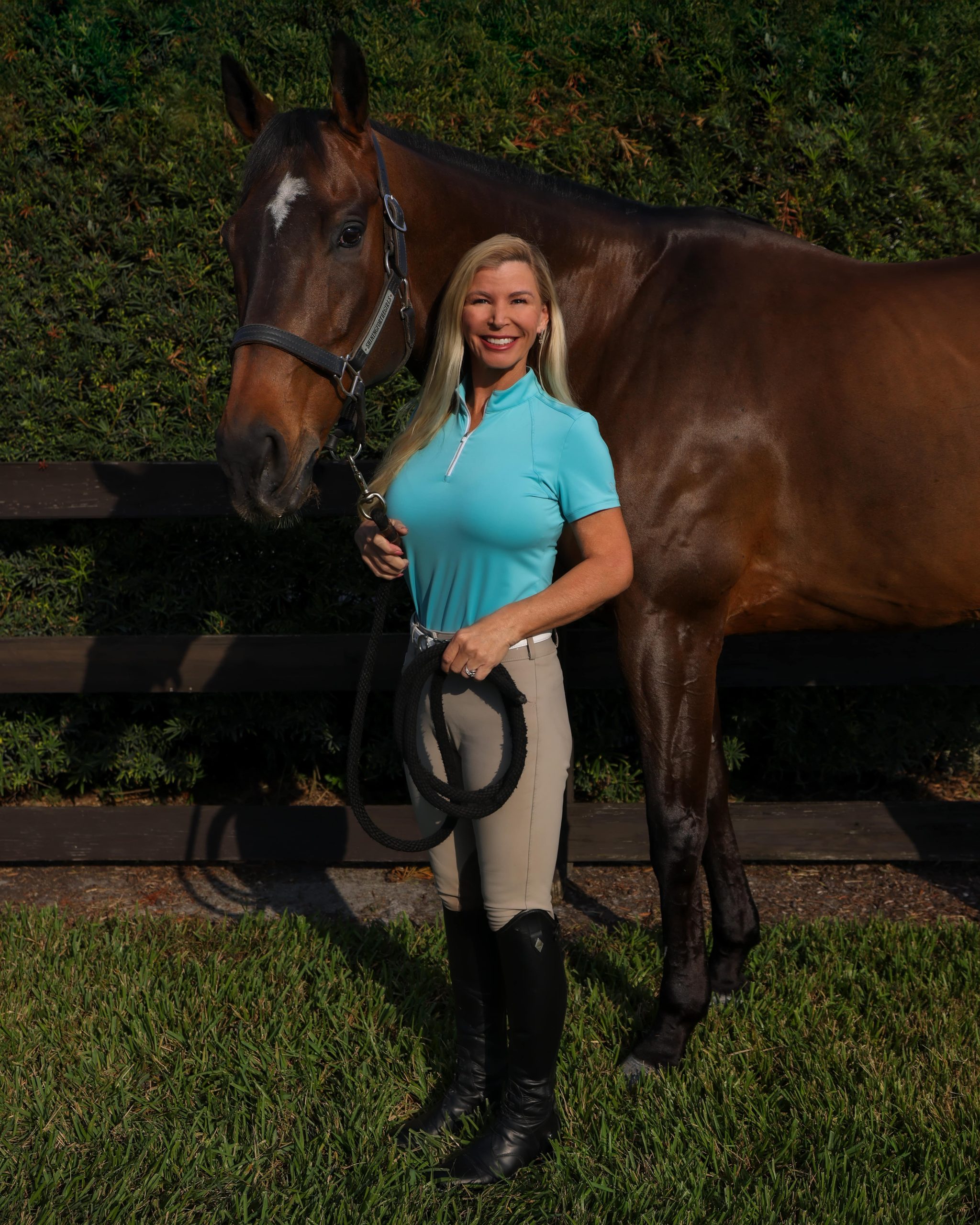 thomasa sanchez next to a brown horse