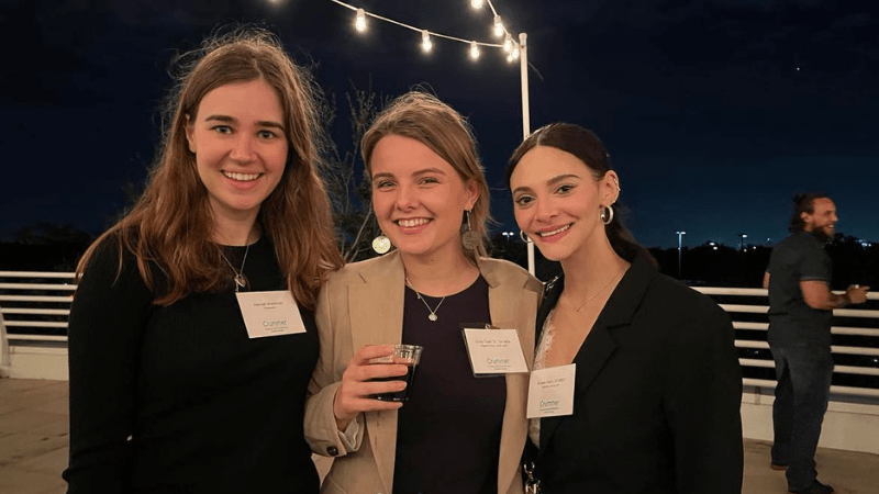 Crummer alumna reconnect at a social gathering.